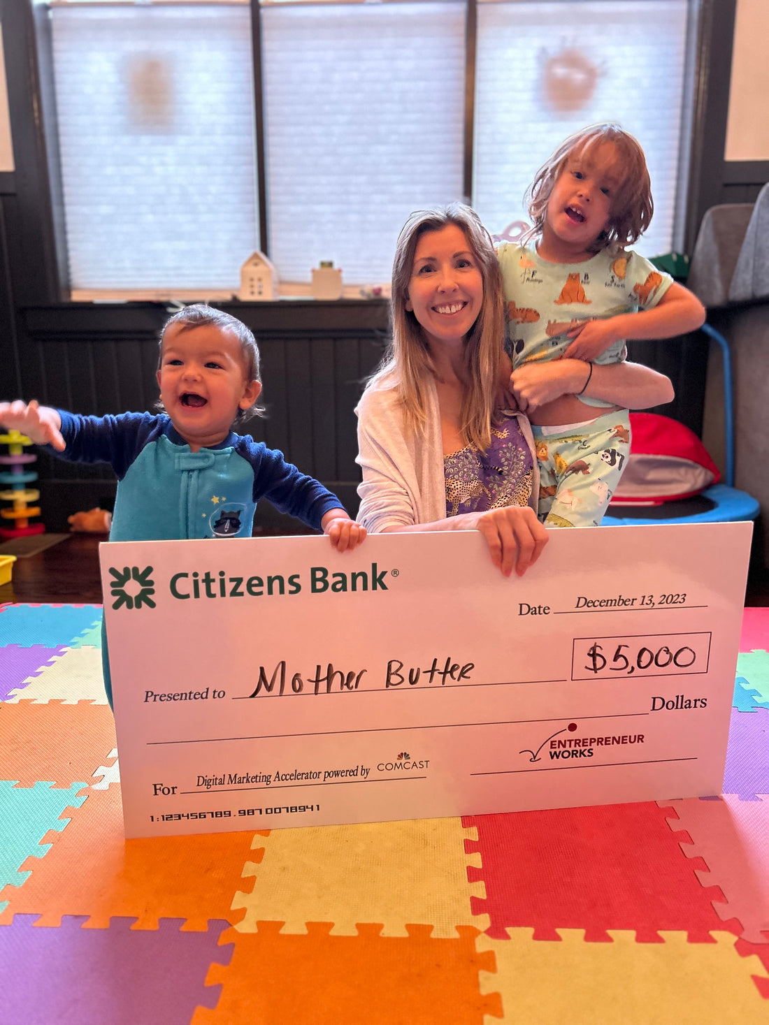 Kristin with sons Alfie and Felix and grant award